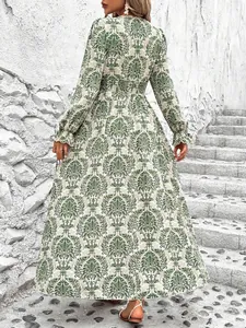 Back view of elegant green damask print long sleeve V-neck bohemian flowy maxi dress