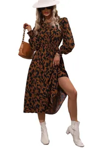 Elegant leopard print long-sleeve maxi dress with waist tie on model, fall winter style