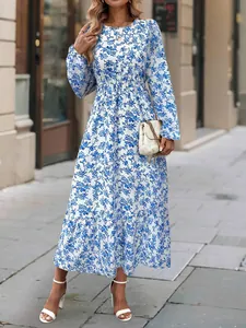 Elegant blue and white floral print long sleeve maxi dress with ruffled hem and round neck.