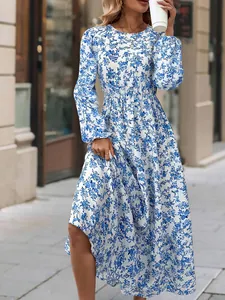 Detailed view of a women's blue floral print long sleeve dress with ruffle hem
