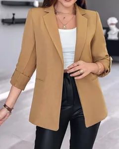 Detail of women's fashion solid color blazer jacket with stylish rolled sleeves