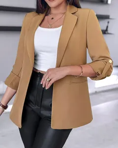 Close-up detail of a stylish khaki blazer featuring rolled button sleeves for women