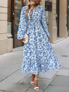 Full view detail of the elegant floral print dress with long sleeves and ruffled hem