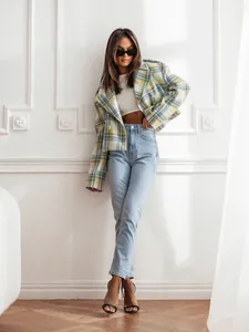 Full view of women's stylish yellow and green plaid wool jacket with classic notch lapels