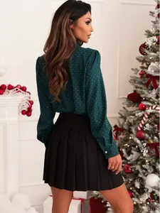 Side view of elegant green rhinestone polka-dot blouse in festive Christmas setting