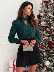Elegant dark green long-sleeved shirt with white polka dots for Christmas outfit look