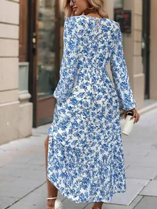 Elegantly detailed back view of blue floral long sleeve maxi dress with ruffles.