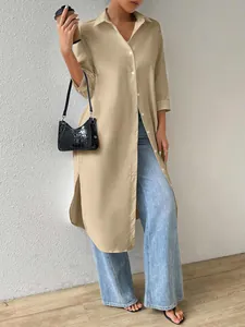 Long khaki button-down shirt cardigan with side slits styled with blue wide-leg jeans