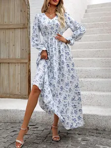 Elegant blue floral V-neck maxi dress with long sleeves and an elastic smocked waist