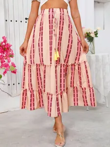 Close-up showing the ruffled tiered layers and vertical stripe print of the maxi skirt