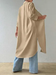 Back view of a long khaki cardigan shirt showing the loose fit and side slit detail