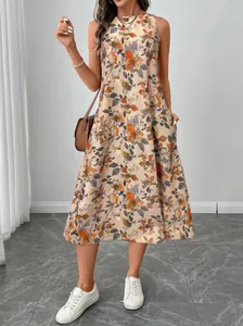 Fashionable front view of sleeveless floral dress with pockets and white sneakers