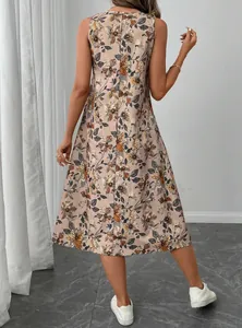 Back view of a floral sleeveless A-line midi dress for women in a neutral setting
