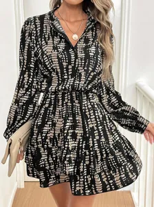 Chic long sleeve V-neck dress with abstract print and ruffled hem for a slim fit
