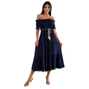 Elegant navy blue off-the-shoulder tiered midi dress with a decorative tassel belt