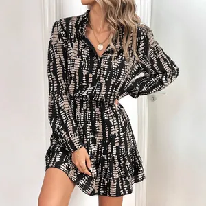 Elegant black and beige abstract print long sleeve V-neck dress with ruffle hem detail