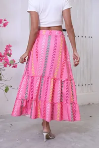 Back view of bohemian pink tiered maxi skirt with colorful geometric arrow print