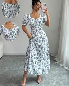 Detailed view of the elegant white and blue floral print dress with puff sleeves