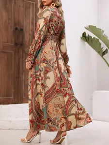 Back detail of a bohemian paisley print long-sleeved maxi dress with smocked waistline
