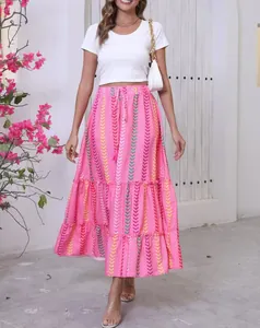 Detail shot of the vibrant pink bohemian print maxi skirt with tiered ruffled hem