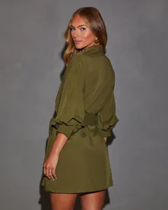 Detailed macro view of the back of this olive green long-sleeved belted shirt dress