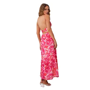 Elegant back view of a pink floral maxi dress with thin straps and a chic open back design