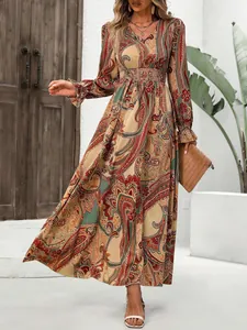 Detail view of bohemian paisley print V-neck long sleeve maxi dress for women's autumn style