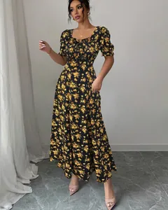 Full view detail of an elegant black floral maxi dress with ruffle sleeves