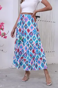 Detail view of bohemian tiered maxi skirt featuring a vibrant blue and pink diamond pattern