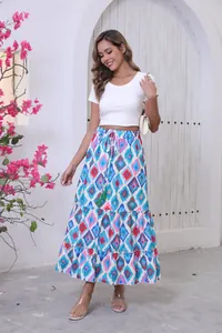 Bohemian printed maxi skirt with a flared hem shown in a summer resort environment.
