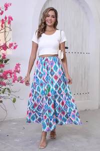 Bohemian vacation style maxi skirt with vibrant geometric print and tiered hemline