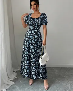 Elegant vintage floral maxi dress featuring a square neckline and puff sleeves detail