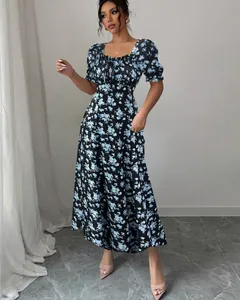 Elegant black floral maxi dress featuring puff sleeves and a ruffled square neckline