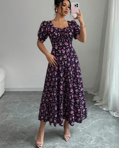 Elegant purple floral short sleeve dress with square neck and puff sleeves detail.
