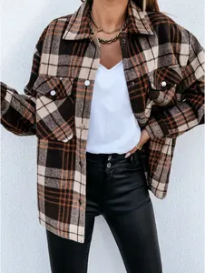 Close-up detail of a vintage brown plaid long-sleeve button-up shacket jacket for women