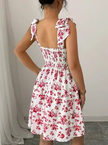 Detailed back view of a summer floral cami dress with shoulder ties and smocking