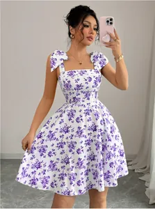 Elegant summer floral camisole dress with purple flower print and cute bow shoulder straps.
