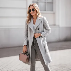 Elegant grey double-breasted wool coat for women featuring a belted waist and lapel collar