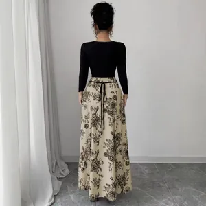 Elegant long sleeve patchwork maxi dress with floral print skirt and adjustable waist tie