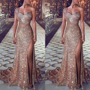 Elegant one-shoulder gold sequin evening gown with high slit and floor-length hem