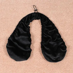 Soft black towel bra with an adjustable halter strap shown on a textured background