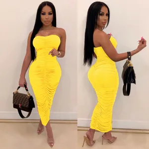Front and side view of a vibrant yellow ruched bodycon strapless maxi dress