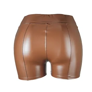 Detailed back view of women's brown PU leather high waist shorts with back stitching