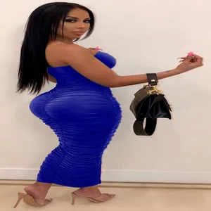 Detailed side profile of a vibrant royal blue ruched strapless bodycon midi dress