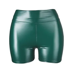 Close-up of shiny dark green PU leather high-waisted shorts for women
