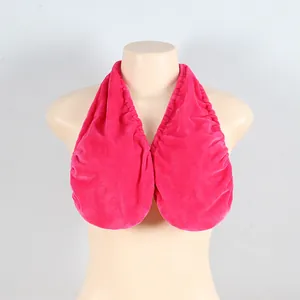 Detail view of a soft pink plush towel bra with a halter neck design on a mannequin