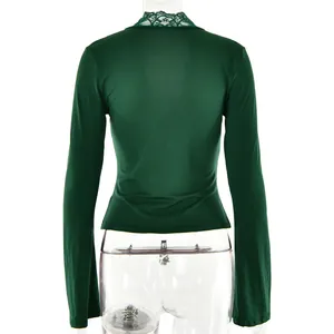 Rear view of a slim-fit dark green long sleeve top featuring elegant lace collar detail