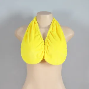Close-up detail of a bright yellow absorbent towel bra made of soft plush fabric