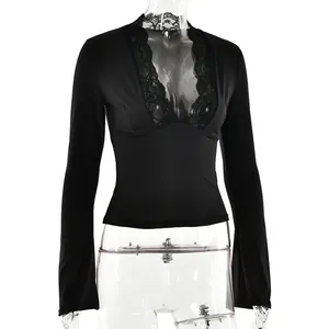 Close-up of black V-neck long sleeve top with delicate lace trim