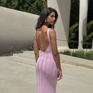 Close-up detail showing the elegant U-shape back design of a pink knitted maxi dress.